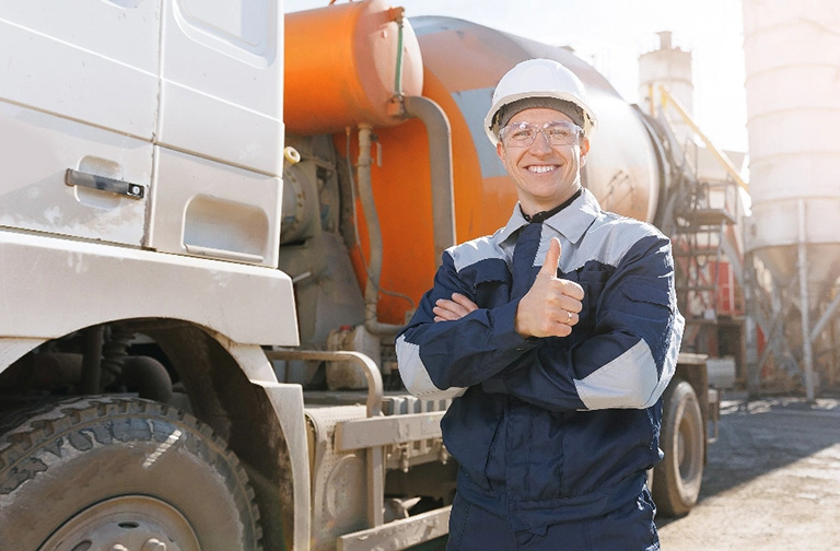 Construction operator smiling with thumbs up