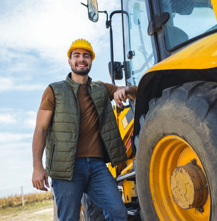 Standing besides tractor